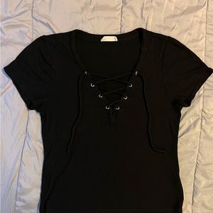 Black crop top with cris cross low cut in front